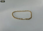 Pulsera de Latón con Bolitas Diamantadas Rayadas de 4 Mm 21CM - fondo verde